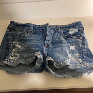 Button fly jean shorts with small cuff and holes. Super comfy